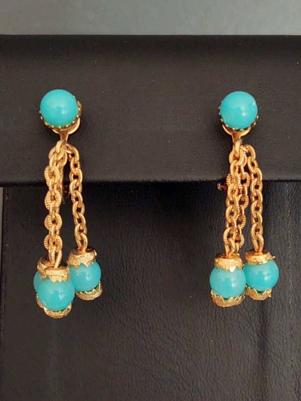 Clip on gold and blue dangle earrings